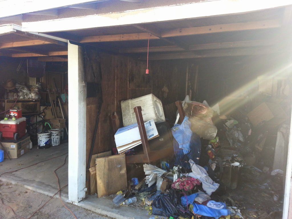 Before: Roof hole from fire damage requiring tarping and board-up in Hesperia
