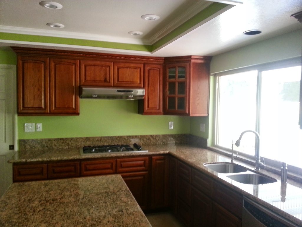 Custom cabinets and granite countertops installed after fire restoration in Pomona kitchen