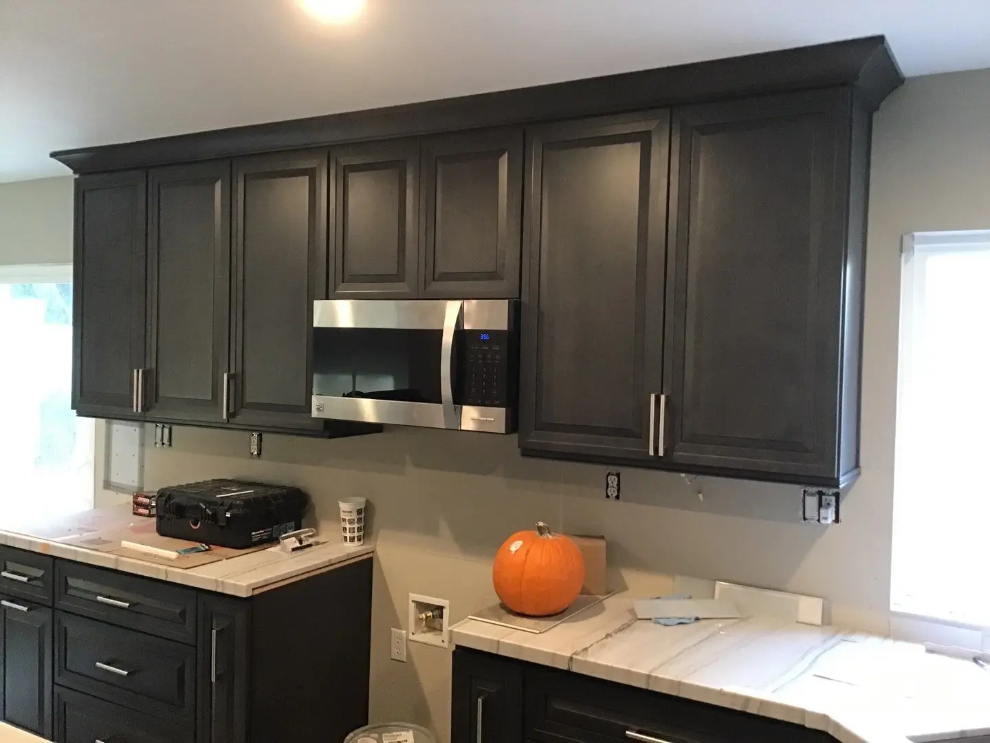 Finished kitchen cabinets and countertop area during Beaumont water damage restoration project by PL Builders
