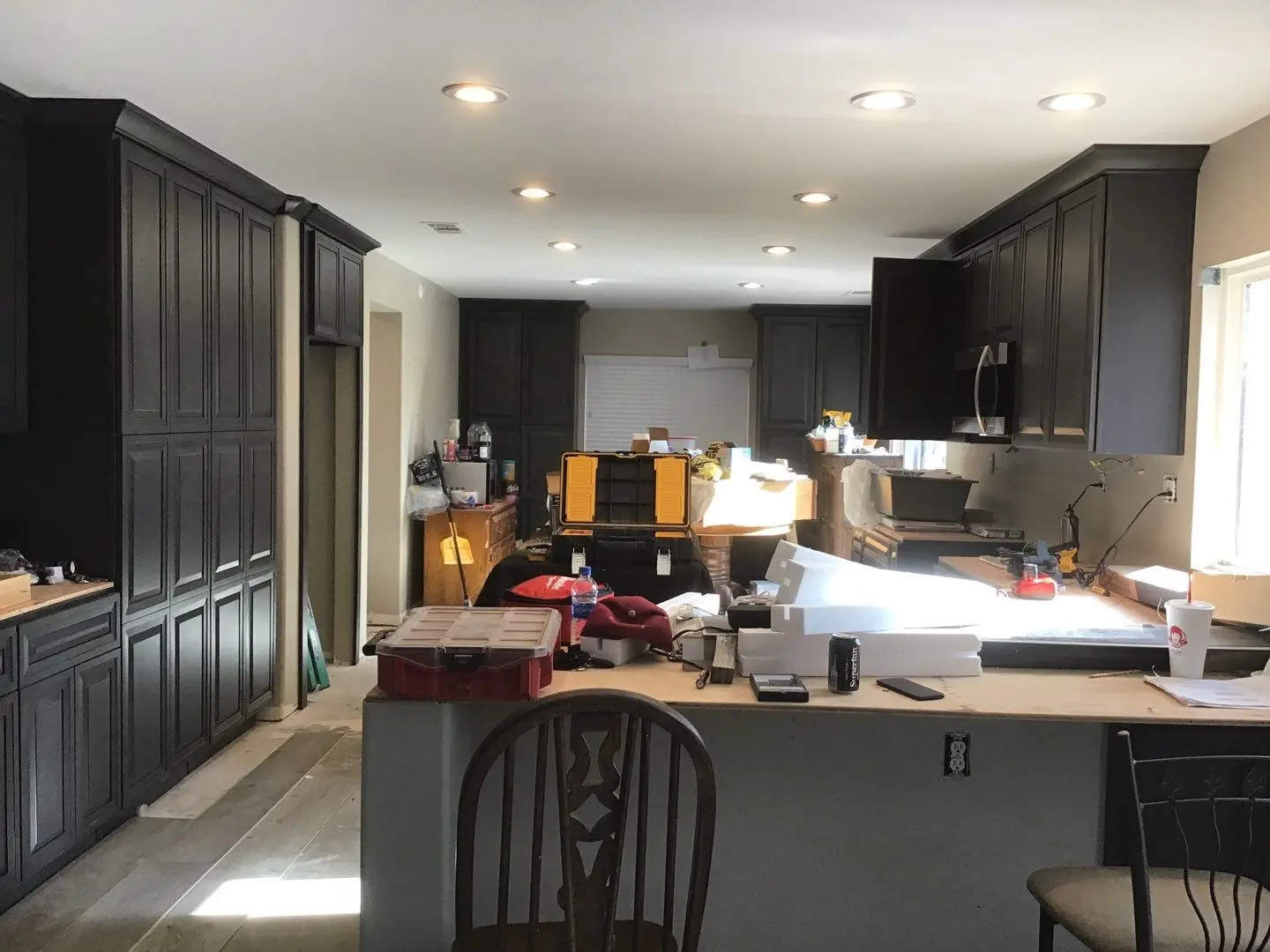 Kitchen cabinet and flooring rebuild before countertop installation during Beaumont water damage restoration project by PL Builders