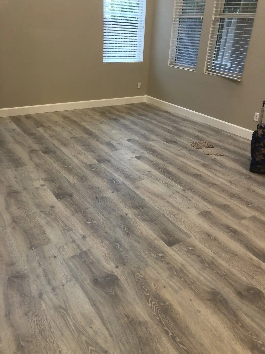 Finished room flooring after repair during Beaumont water damage restoration project by PL Builders