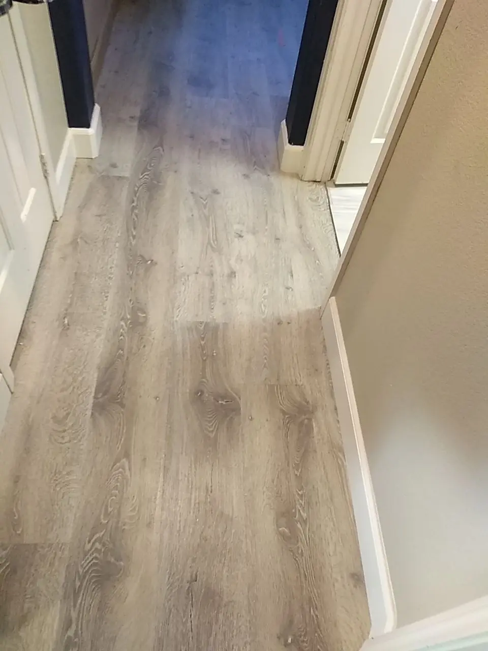Hallway flooring after the rebuild during Beaumont water damage restoration project by PL Builders