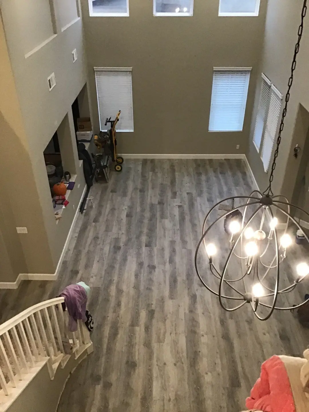 New flooring viewed from the stair landing during Beaumont water damage restoration project by PL Builders