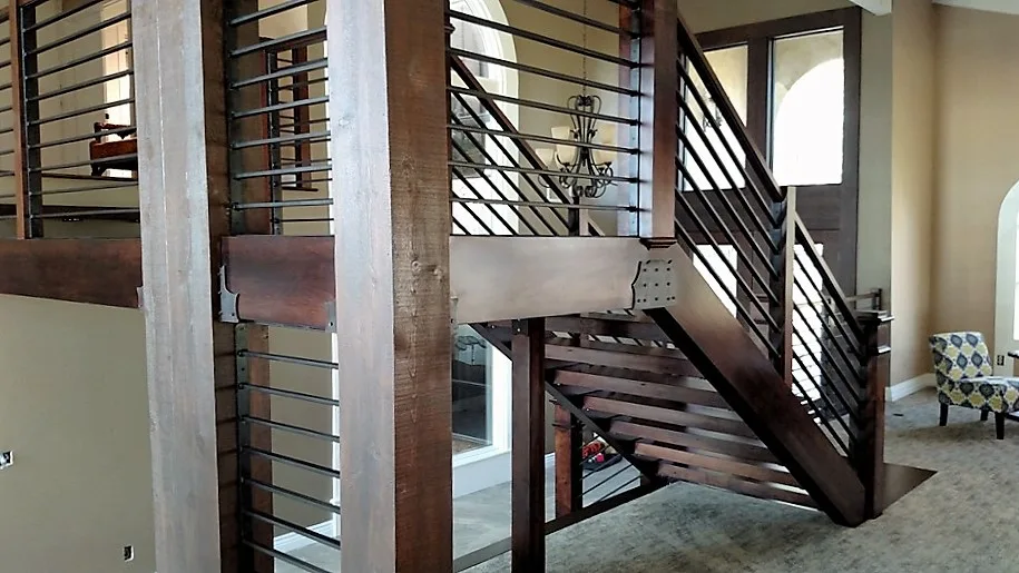 Corona custom stair rebuild project by PL Builders showing custom stair rebuild with wood posts and metal railings