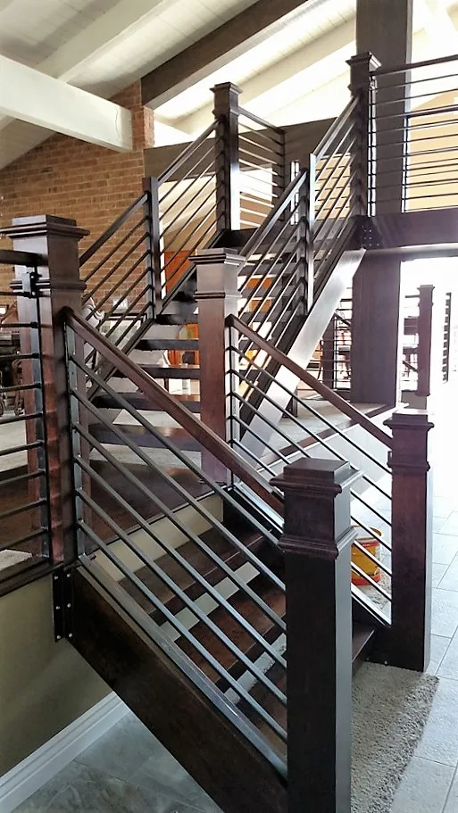 Corona custom stair rebuild project by PL Builders showing finished custom stair rebuild from upper landing