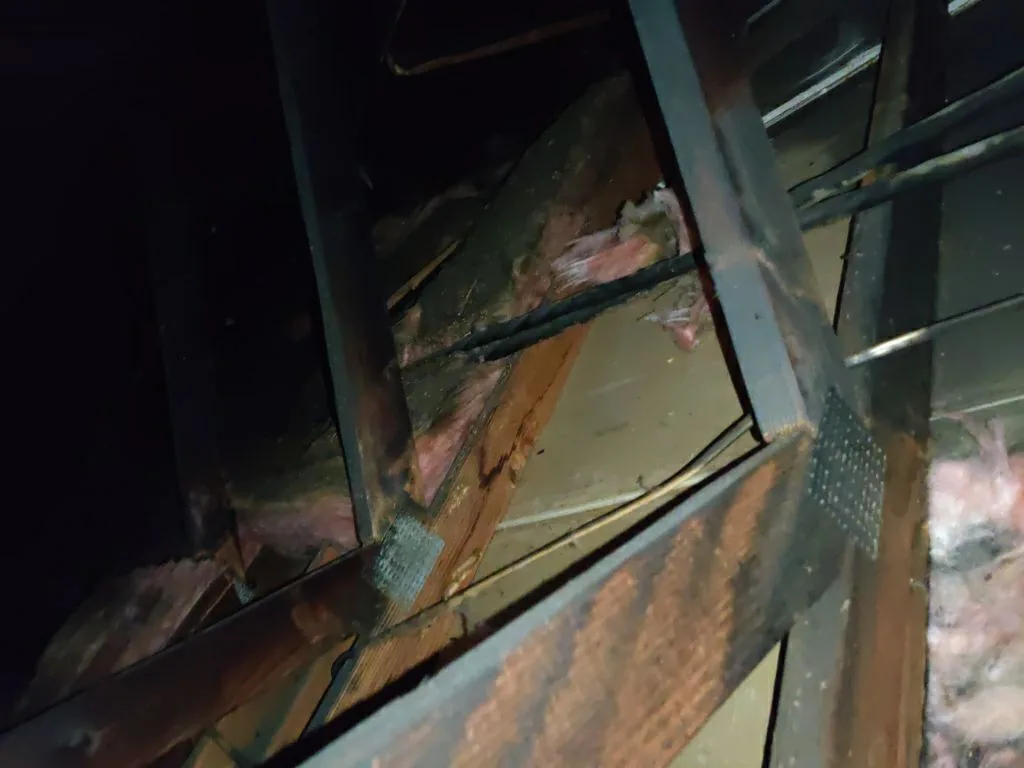 Attic Fire Damage Charred Trusses Roof Framing HVAC Soot from Hemet apartment fire smoke damage restoration documentation - photo 100 of 180