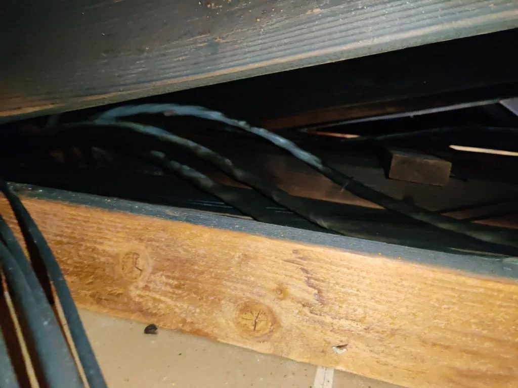 Structural Attic Transition Electrical Box Charred Trusses from Hemet apartment fire smoke damage restoration documentation - photo 105 of 180