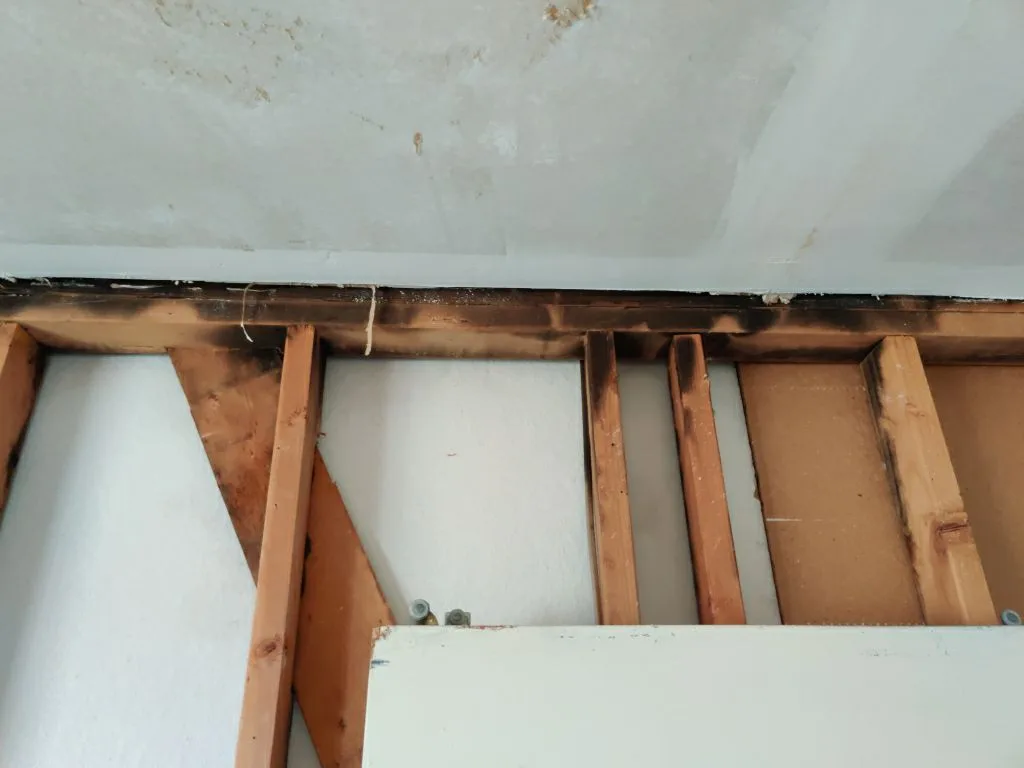 Structural Attic Transition Electrical Box Charred Trusses from Hemet apartment fire smoke damage restoration documentation - photo 113 of 180