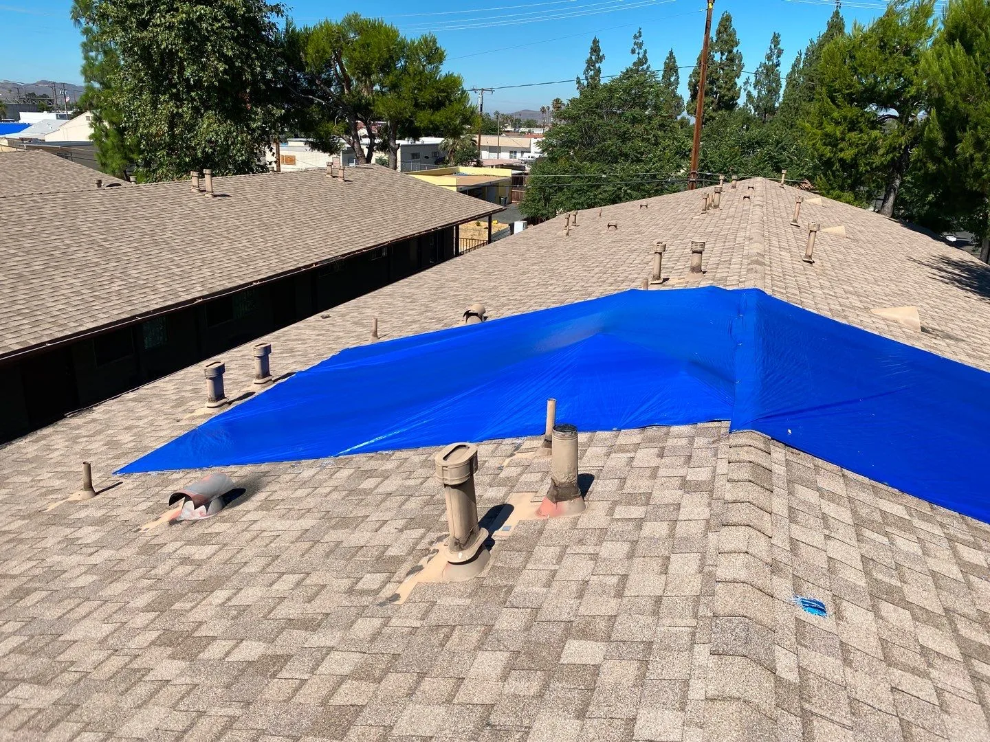 Roof Mitigation Blue Tarp Shingle Roof OSB Patch from Hemet apartment fire smoke damage restoration documentation - photo 121 of 180