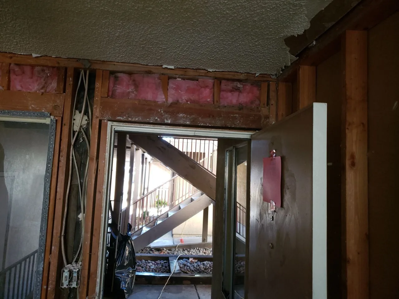 Major Interior Demolition Ceiling Open Framing Insulation Removal from Hemet apartment fire smoke damage restoration documentation - photo 81 of 180