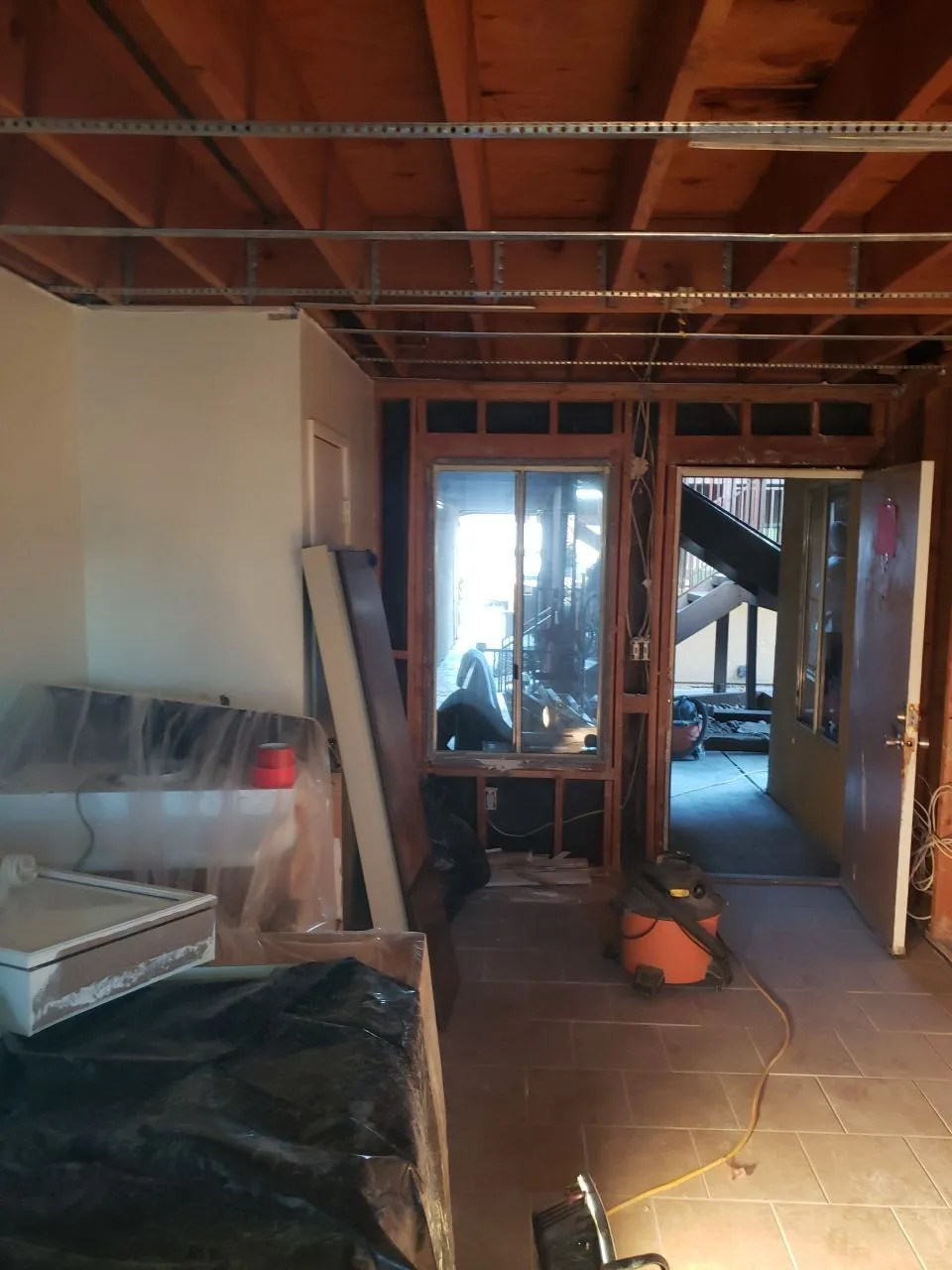 Major Interior Demolition Ceiling Open Framing Insulation Removal from Hemet apartment fire smoke damage restoration documentation - photo 85 of 180