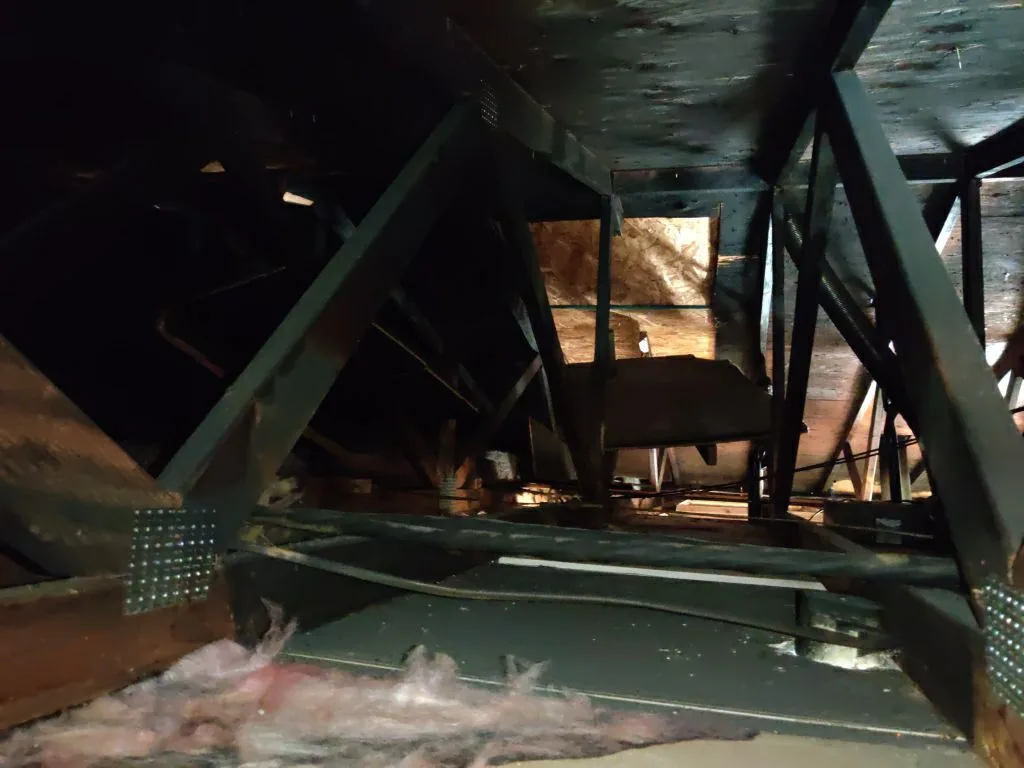 Attic Fire Damage Charred Trusses Roof Framing HVAC Soot from Hemet apartment fire smoke damage restoration documentation - photo 94 of 180