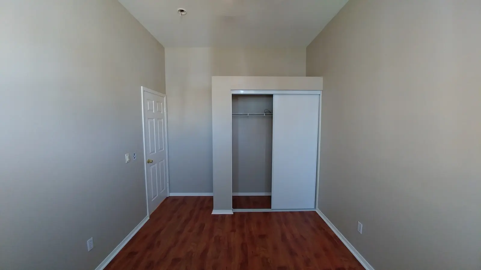 Jurupa Valley burst pipe kitchen water damage restoration project by PL Builders showing finished hallway and closet flooring after burst pipe repair