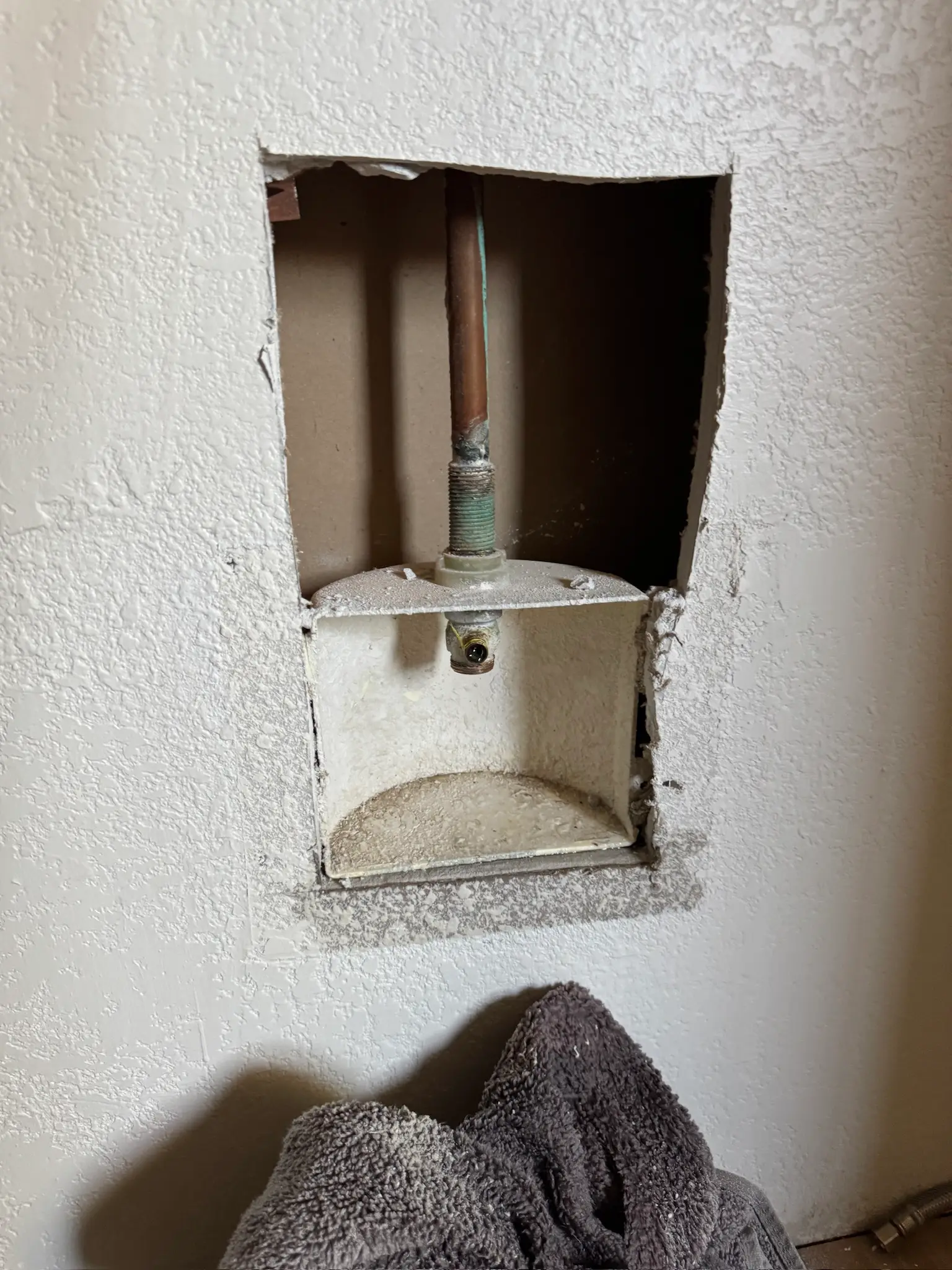 Appliance water line wall opening documentation 005 during Menifee water damage restoration project by PL Builders