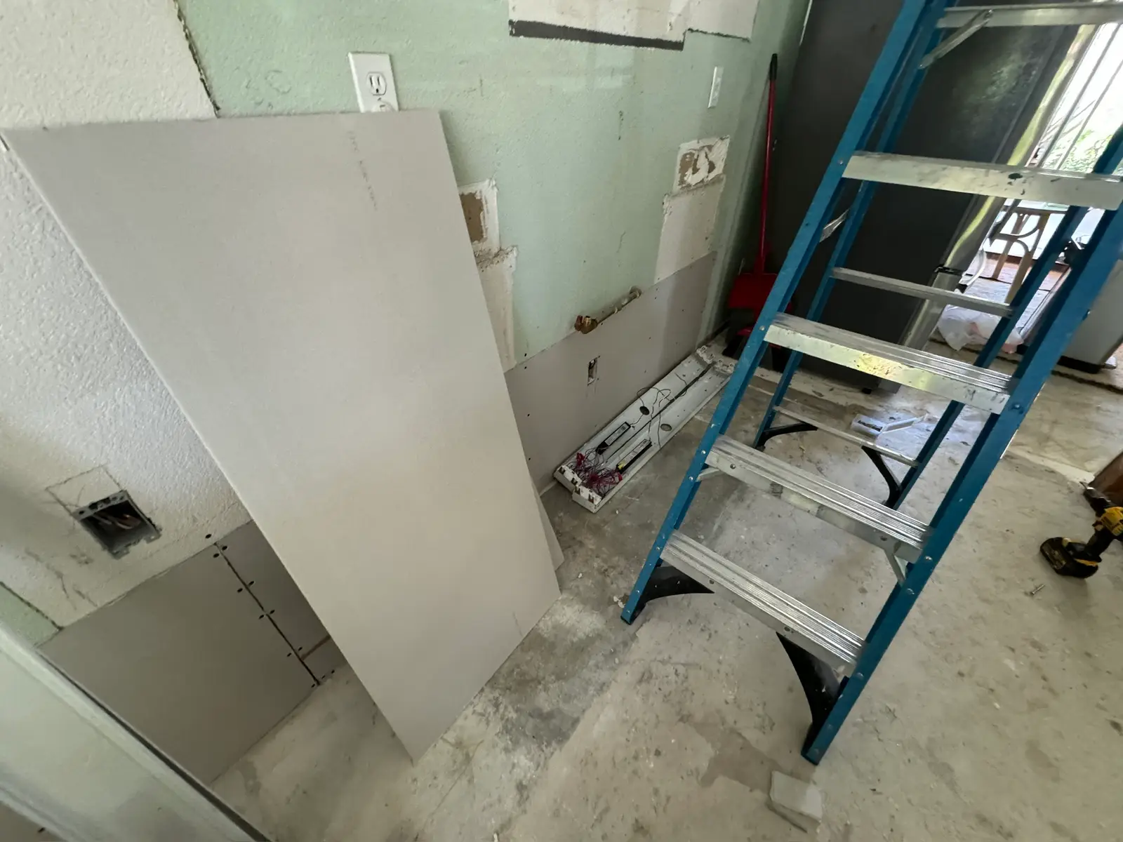 Kitchen repair progress after refrigerator leak 075 during Menifee water damage restoration project by PL Builders