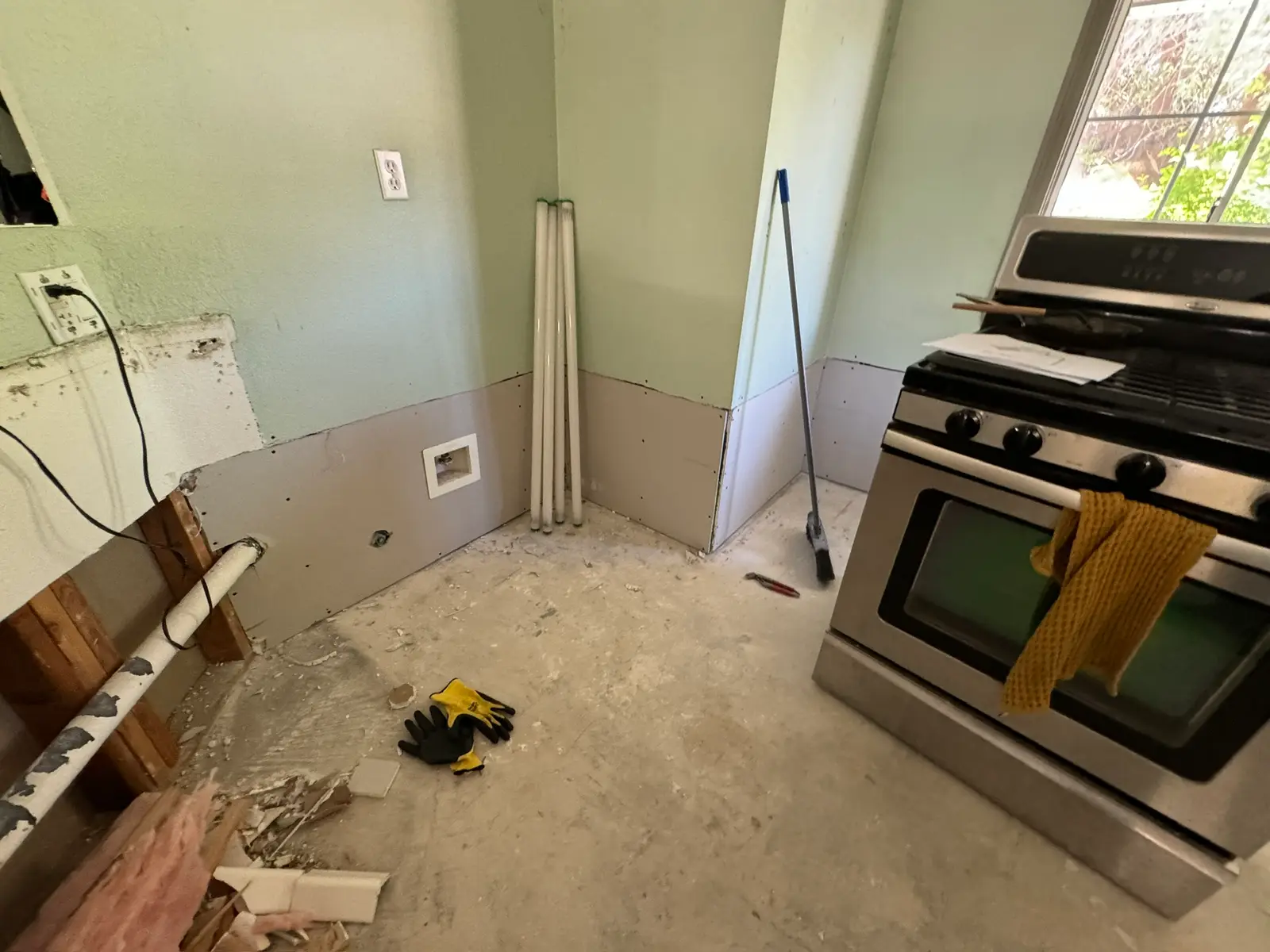 Kitchen repair progress after refrigerator leak 077 during Menifee water damage restoration project by PL Builders