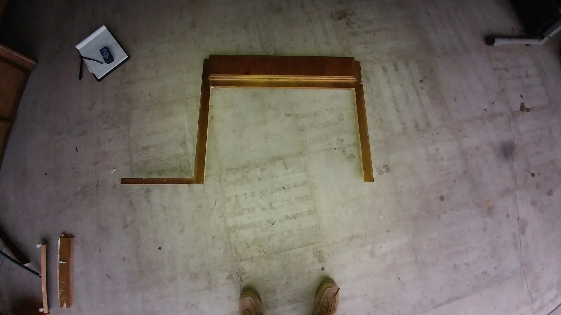 Moreno Valley slab leak kitchen water damage repair project by PL Builders showing removed kitchen flooring and cabinet toe kick after slab leak