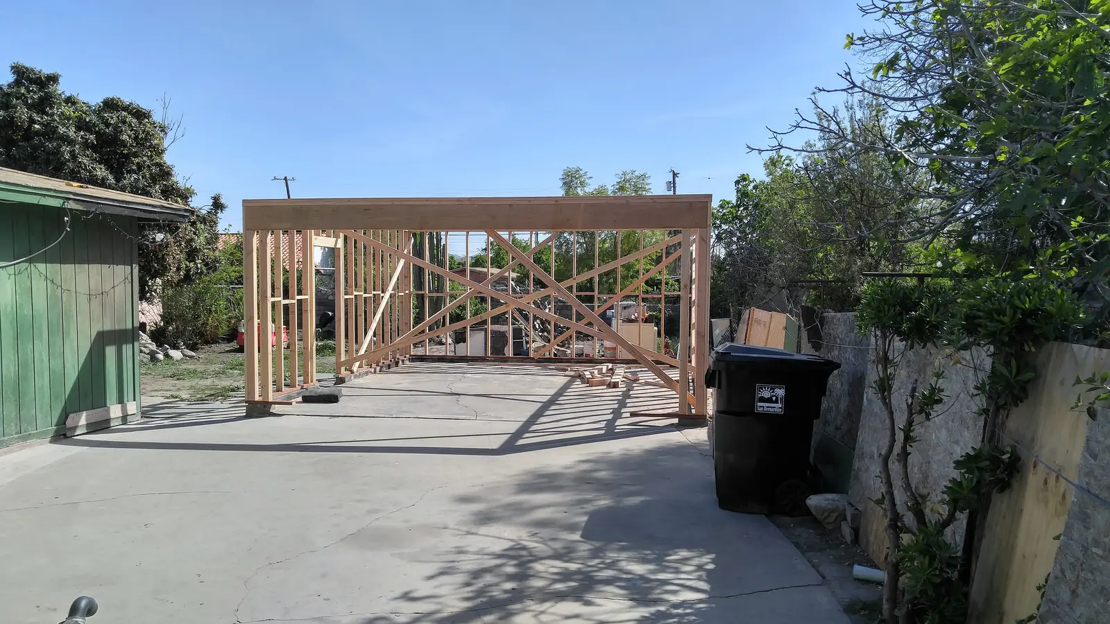 San Bernardino garage fire damage rebuild project by PL Builders showing new garage framing after fire damage demolition