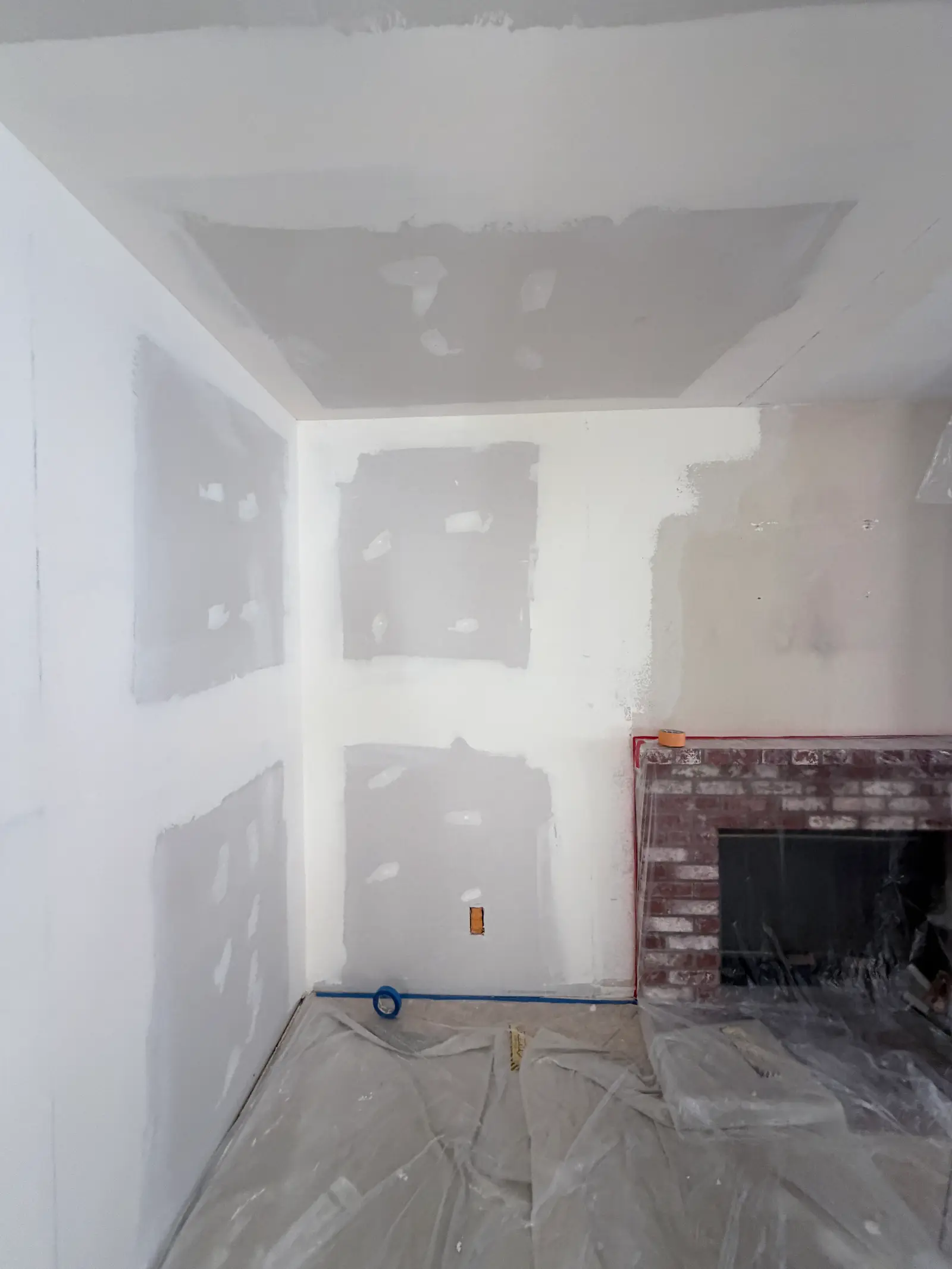 Bathroom drywall patching after mitigation during Temecula water damage restoration project by PL Builders