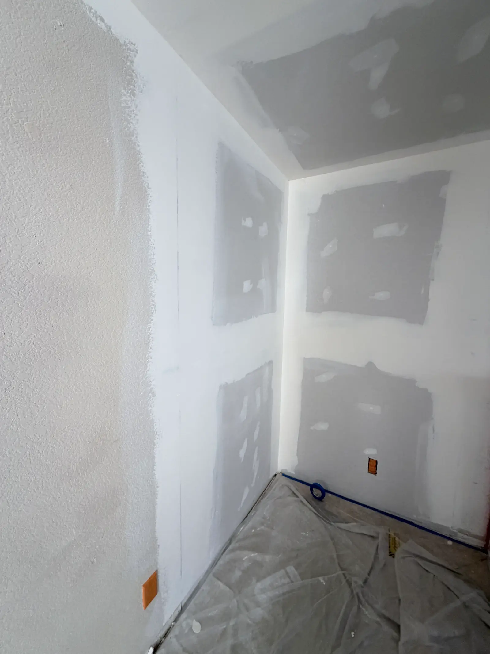 Bathroom drywall repair after leak damage during Temecula water damage restoration project by PL Builders