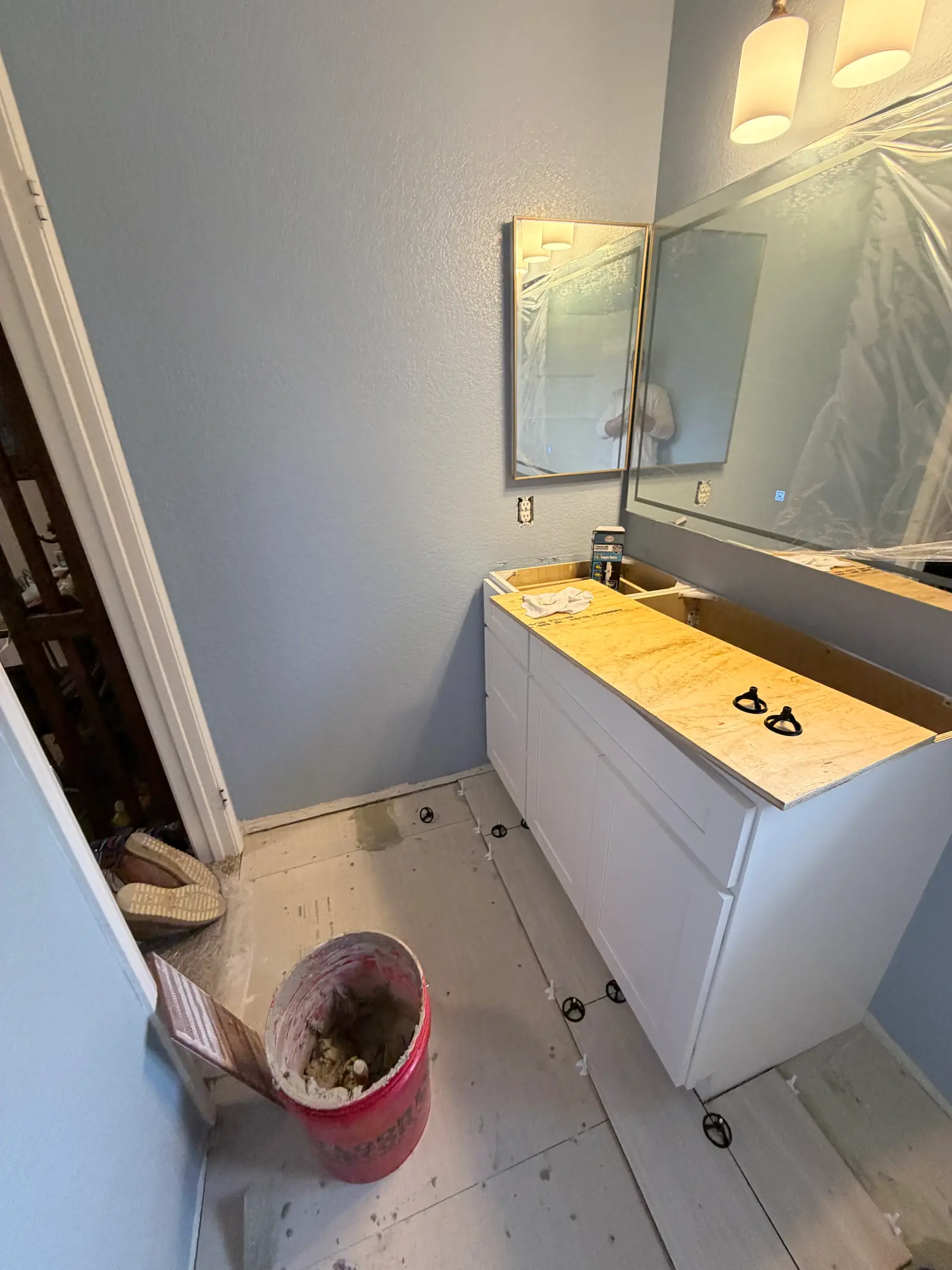 Bathroom vanity reconstruction progress during Temecula water damage restoration project by PL Builders