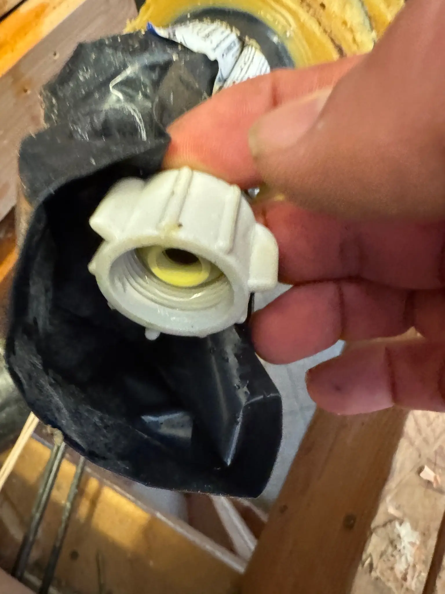 Broken toilet drain connection documented during repair during Temecula water damage restoration project by PL Builders