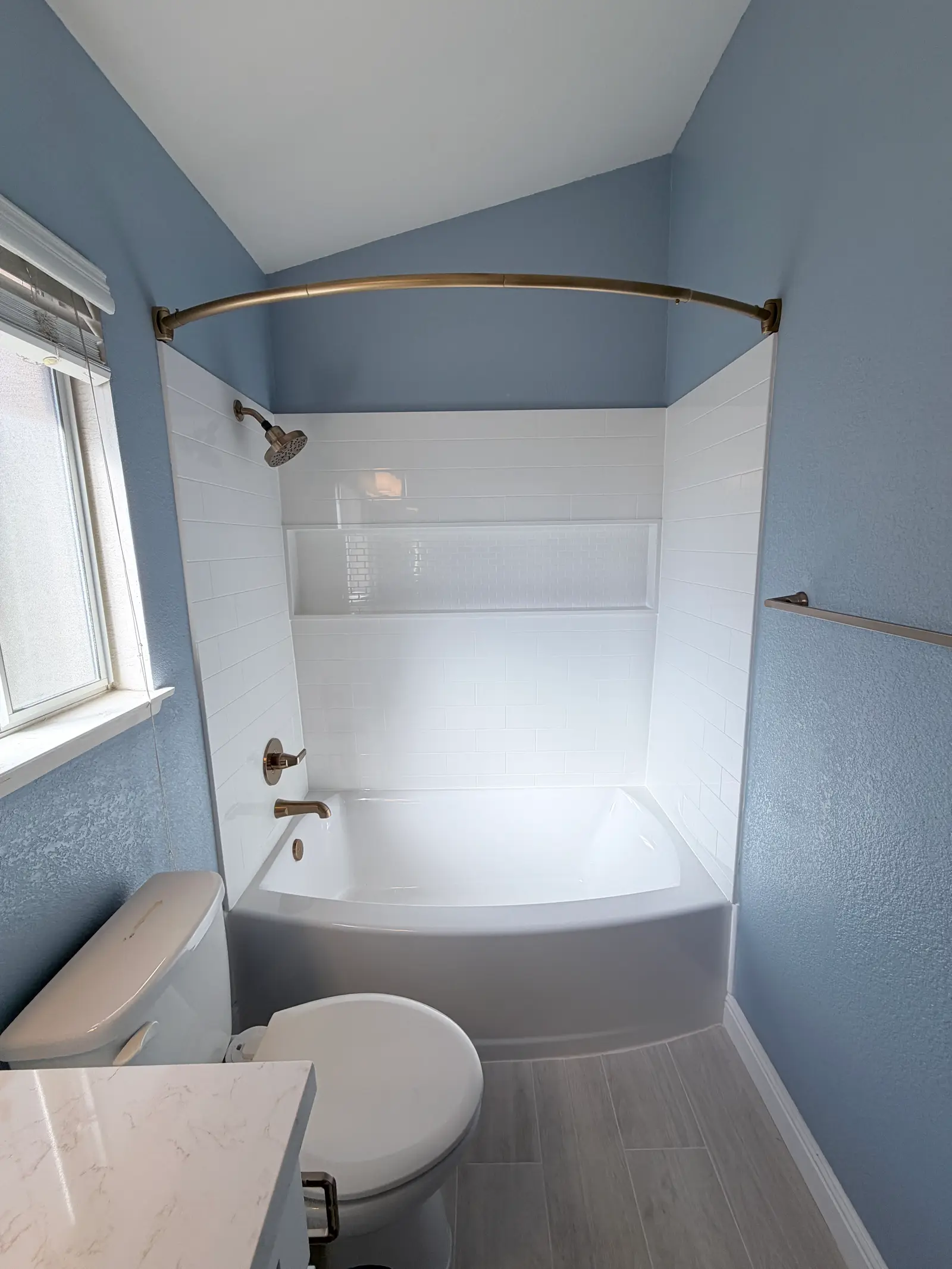 Finished bathroom overview after water damage repair during Temecula water damage restoration project by PL Builders