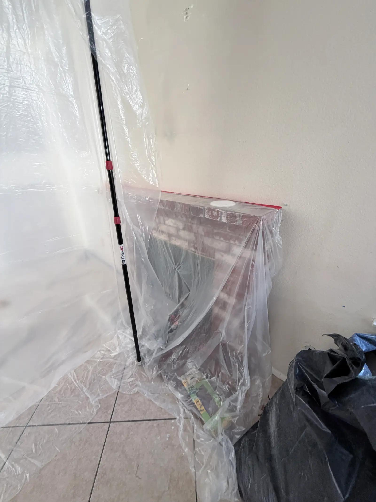 Protected bathroom floor during repair work during Temecula water damage restoration project by PL Builders