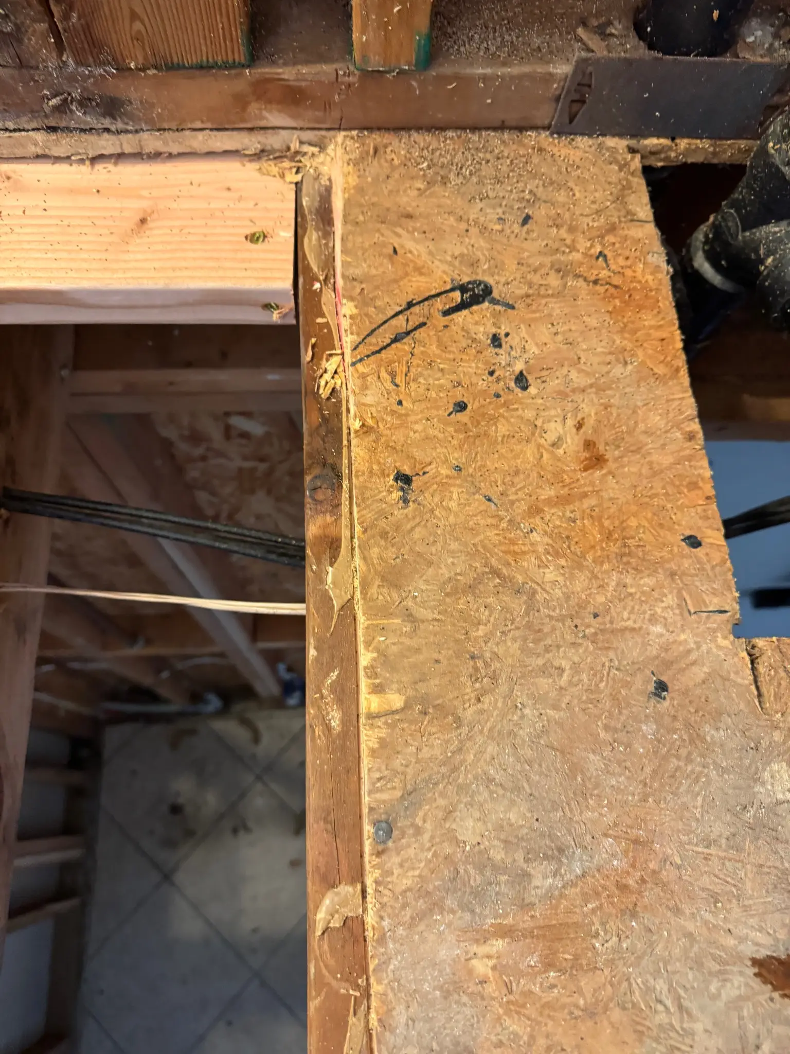 Subfloor repair area after toilet drain leak during Temecula water damage restoration project by PL Builders