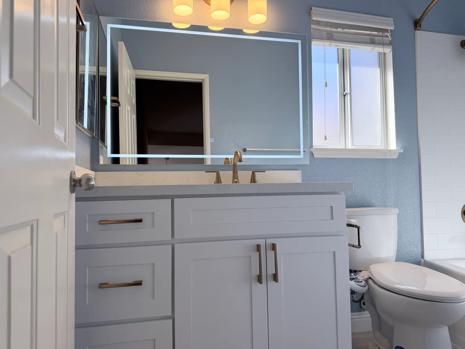 Temecula bathroom vanity rebuild after water damage from Temecula water damage restoration project by PL Builders