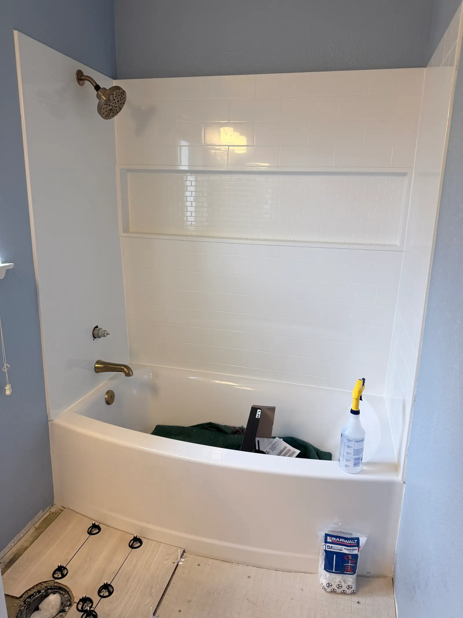 Tub and bathroom finish after reconstruction during Temecula water damage restoration project by PL Builders