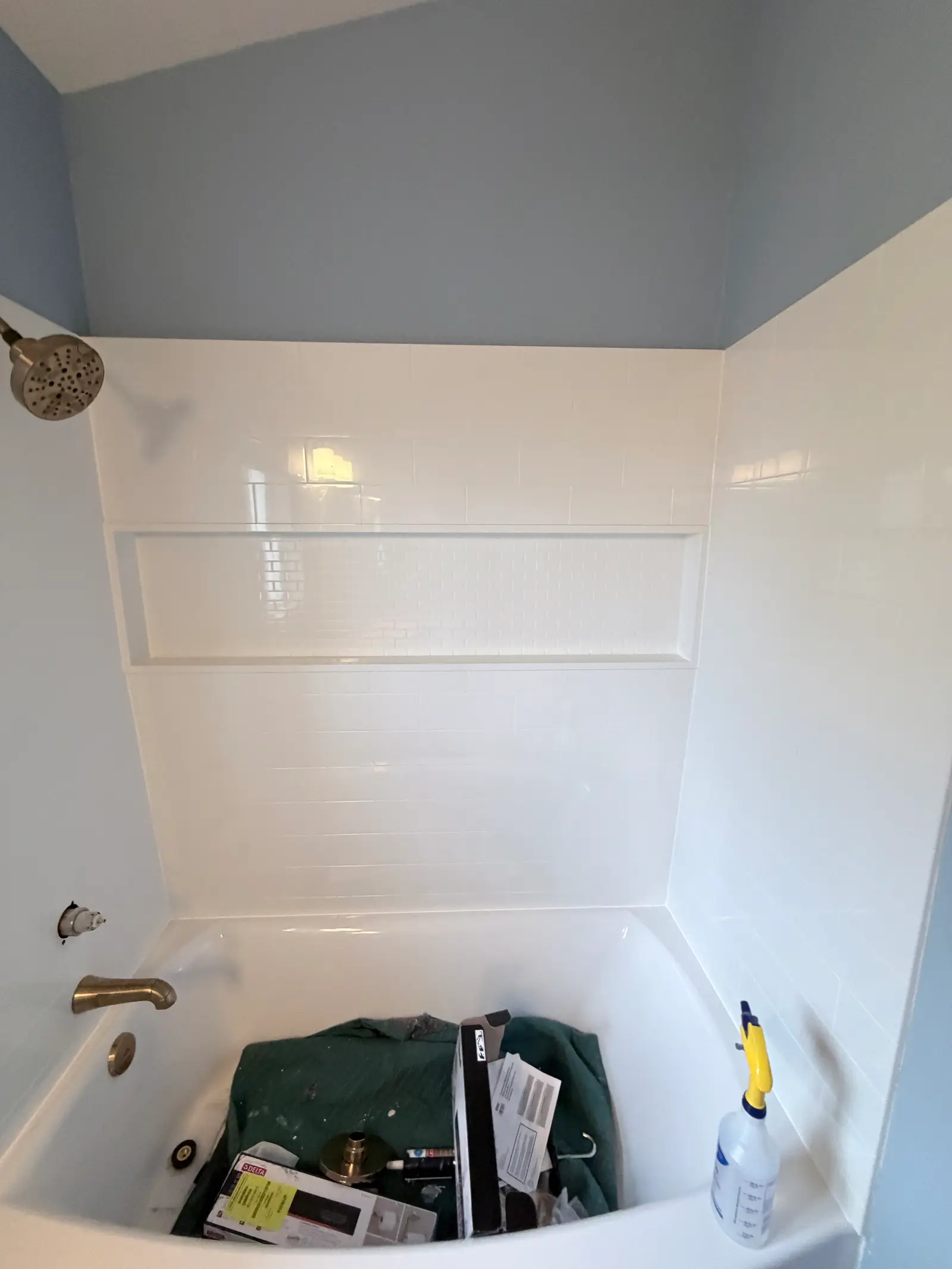 Tub surround and wall repair after dry-out during Temecula water damage restoration project by PL Builders