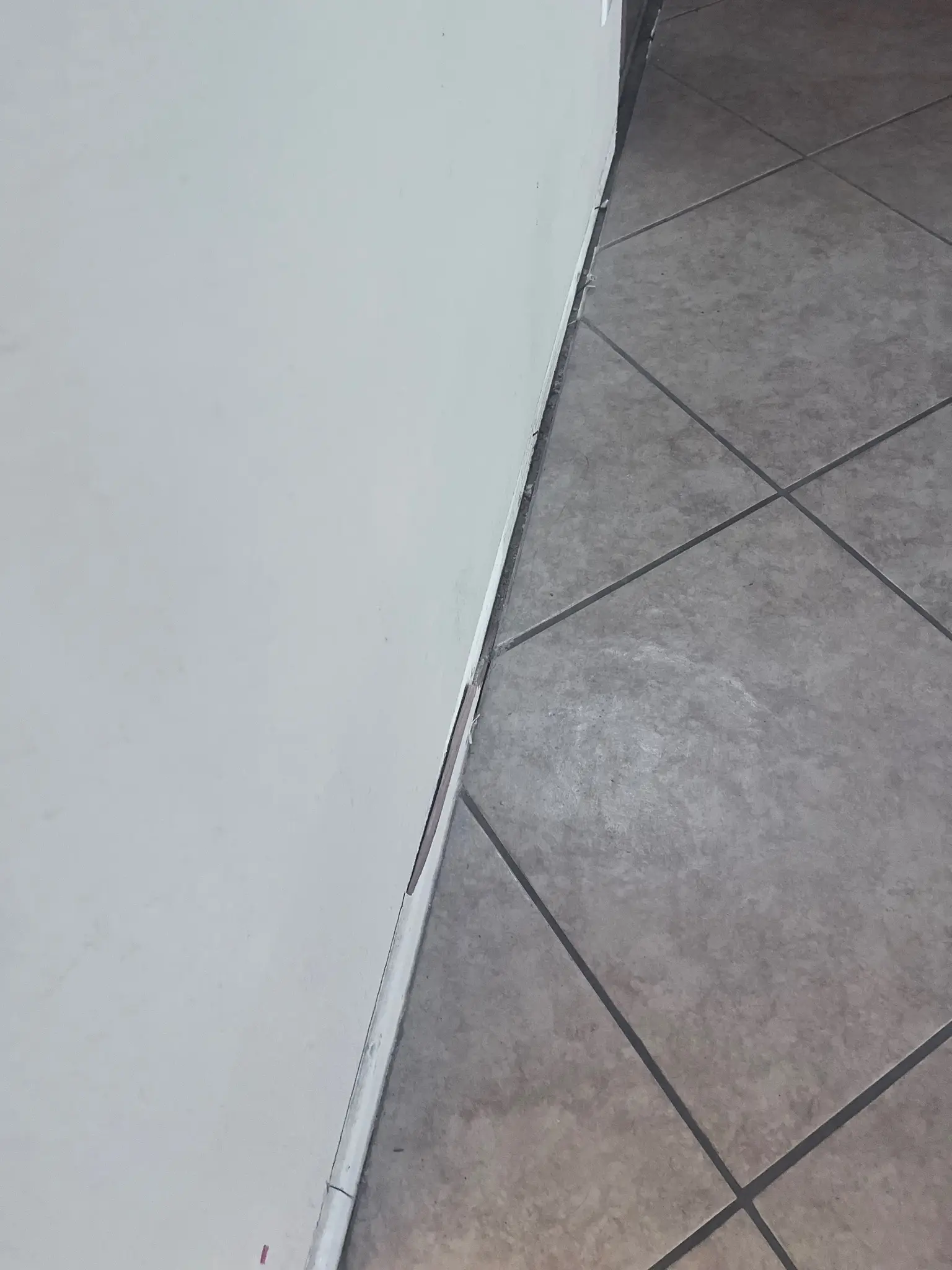 Wall and tile floor repair documentation during Temecula water damage restoration project by PL Builders