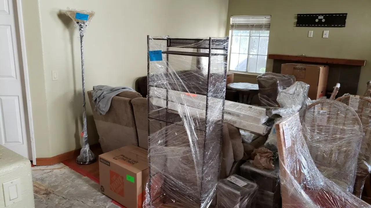 Packed and protected contents before reconstruction 90 during Temecula water damage restoration project by PL Builders