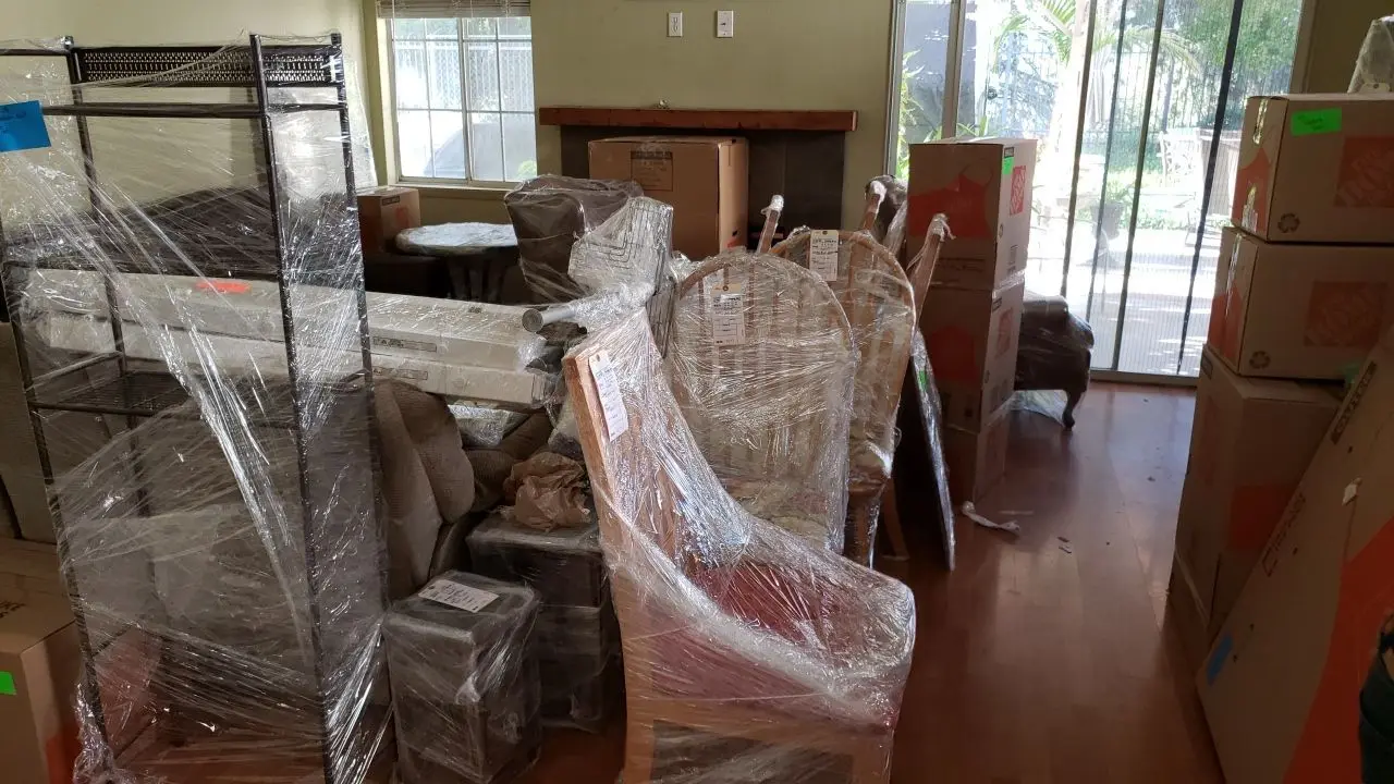 Packed and protected contents before reconstruction 91 during Temecula water damage restoration project by PL Builders
