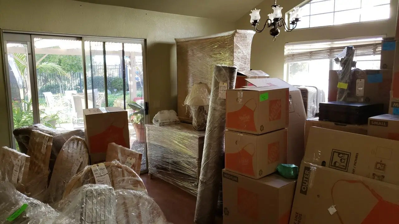 Packed and protected contents before reconstruction 92 during Temecula water damage restoration project by PL Builders