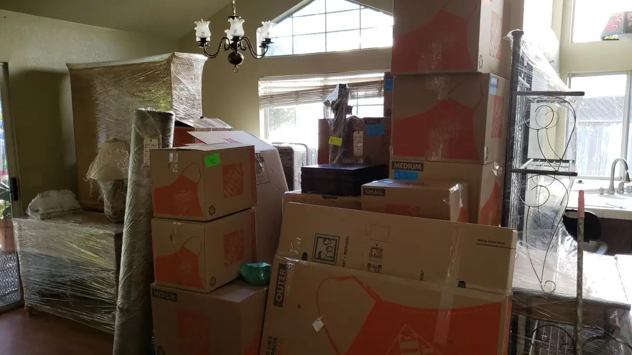 Packed and protected contents before reconstruction 93 during Temecula water damage restoration project by PL Builders