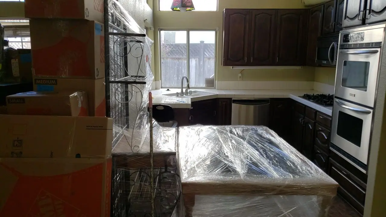 Packed and protected contents before reconstruction 94 during Temecula water damage restoration project by PL Builders
