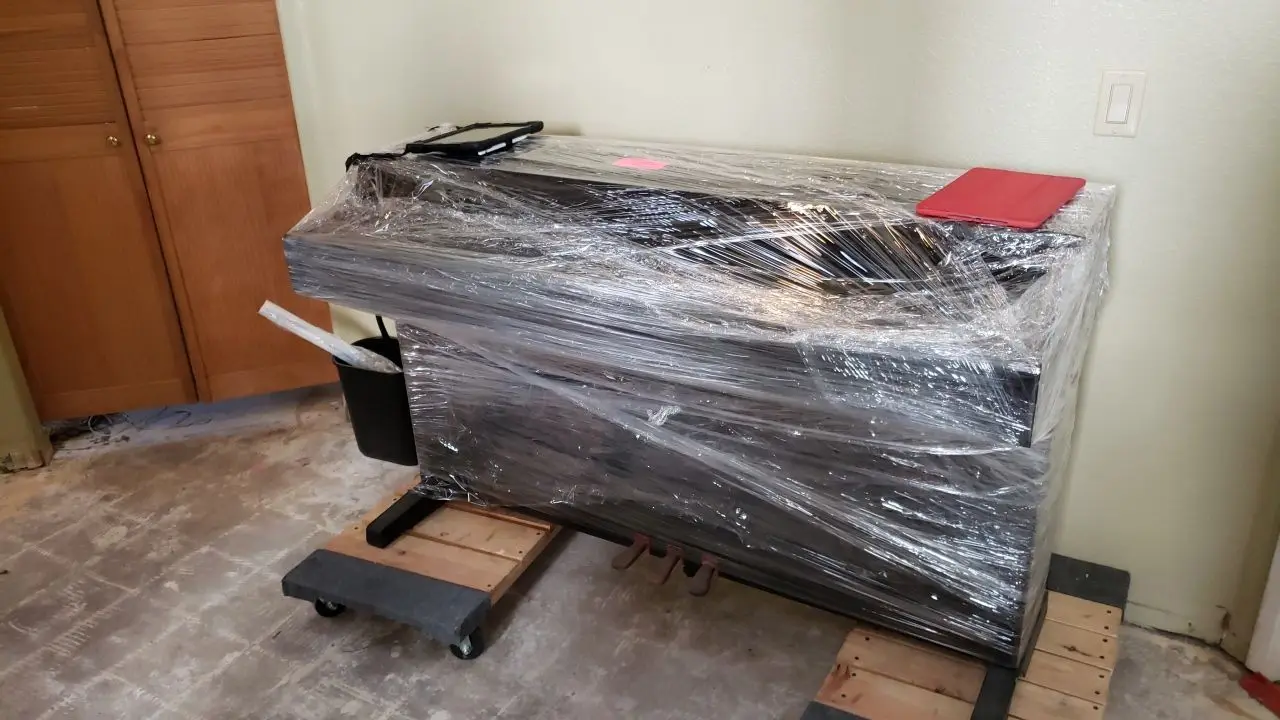Packed and protected contents before reconstruction 95 during Temecula water damage restoration project by PL Builders