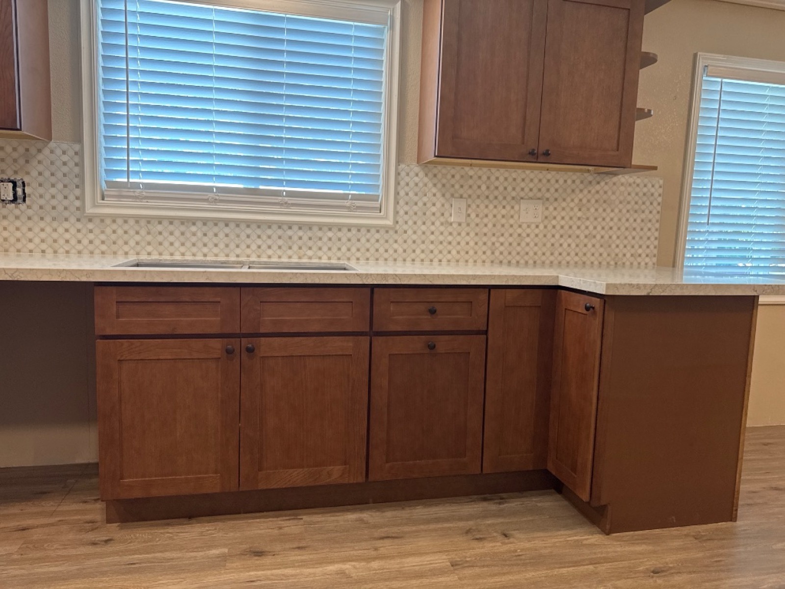 Kitchen cabinets and Calacatta Pietra quartz with MSI Bianco Dolomite Cream Dotty backsplash — Reflection Lake, San Jacinto, CA — PL Builders